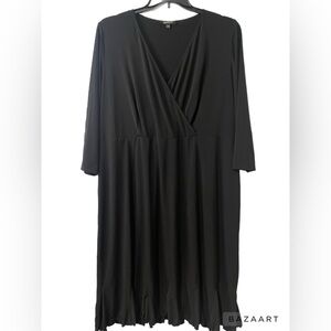 Glamour brand black faux wrap dress with amazing detailed skirt flares. JJ14
